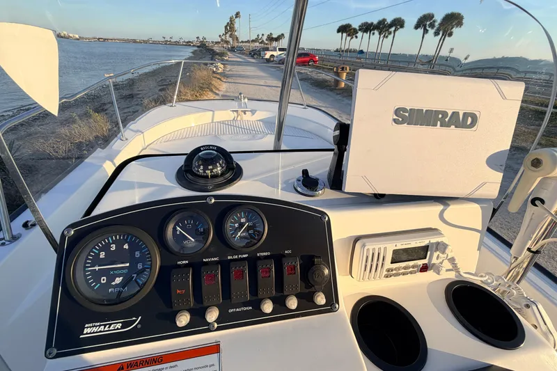 Slide: The Image of Dashboard of a 2010 Boston Whaler 170 Montauk with Simrad navigation system. - 34