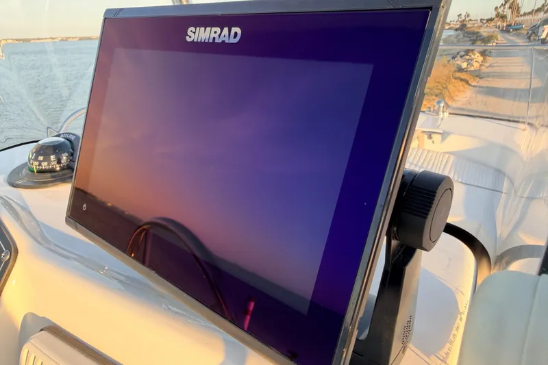 Slide: The Image of Simrad display on 2010 Boston Whaler 170 Montauk boat, with compass and scenic view. - 36