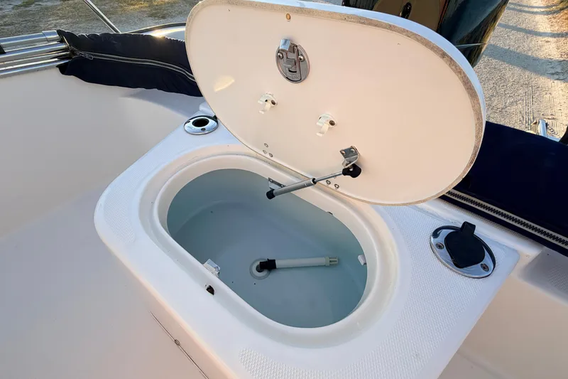 Slide: The Image of Open storage compartment on a 2010 Boston Whaler 170 Montauk boat. - 48
