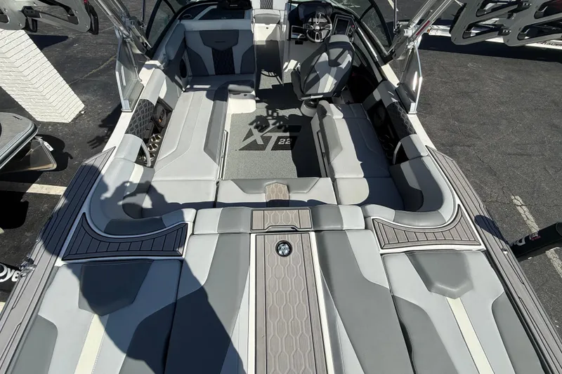 Slide: The Image of 2023 MasterCraft XT22 boat interior with sleek seating and modern design. - 3