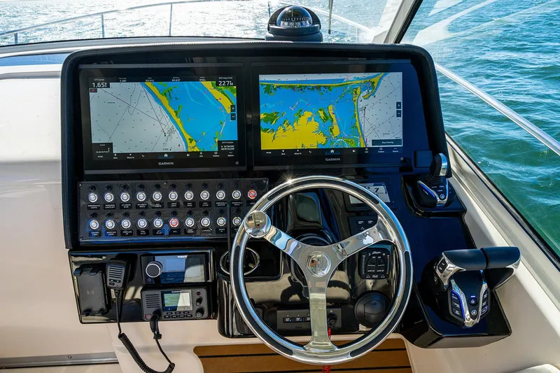 Slide: The Image of Manufacturer Provided Image: Helm of 2026 Grady-White Express 340 with dual Garmin displays and controls. - 13
