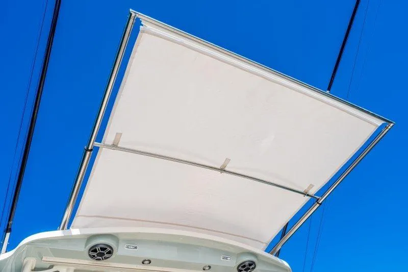 Slide: The Image of 2026 Grady-White Express 340 boat canopy against clear blue sky. - 16