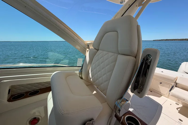 Slide: The Image of Luxurious seating on 2026 Grady-White Express 340 boat, overlooking serene ocean view. - 22