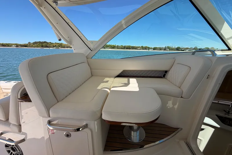 Slide: The Image of Luxurious seating area on 2026 Grady-White Express 340 boat with scenic water view. - 26