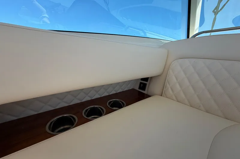 Slide: The Image of Luxurious interior of 2026 Grady-White Express 340 with quilted seating and cup holders. - 27