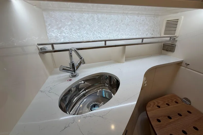Slide: The Image of Luxurious bathroom sink area in 2026 Grady-White Express 340 boat. - 37