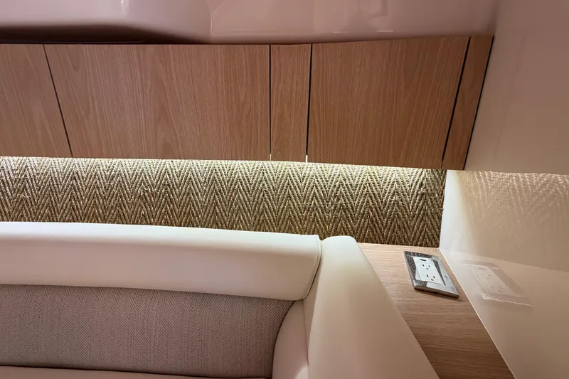 Slide: The Image of 2026 Grady-White Express 340 interior with wood cabinets and textured wall paneling. - 41