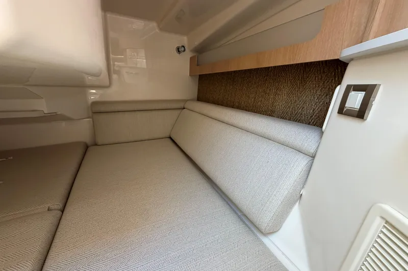 Slide: The Image of Interior cabin of 2026 Grady-White Express 340, featuring beige upholstery and modern design elements. - 42