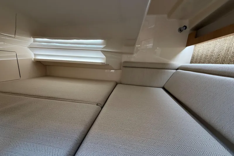 Slide: The Image of 2026 Grady-White Express 340 cabin interior with comfortable seating and modern design. - 43