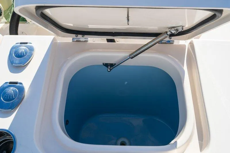 Slide: The Image of Open hatch on 2026 Grady-White Express 340 boat, showcasing interior compartment. - 6