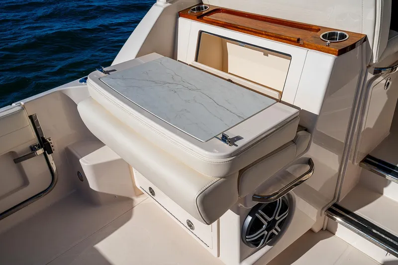 Slide: The Image of Manufacturer Provided Image: 2026 Grady-White Express 340 boat interior with foldable seat and storage compartment. - 8
