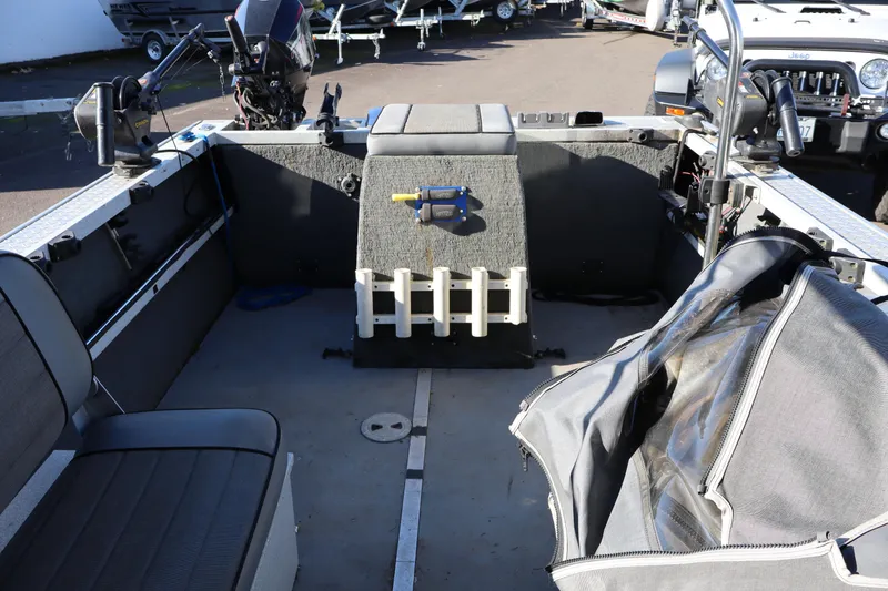 Slide: The Image of Interior of a 2000 Alumaweld Intruder Outboard 20 boat with seating and equipment. - 5