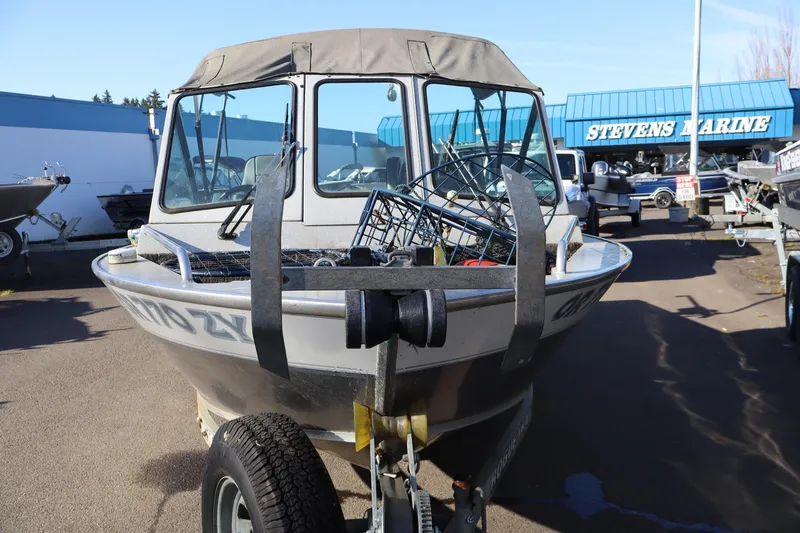 Slide: The Image of 2000 Alumaweld Intruder Outboard 20 boat on trailer at Stevens Marine dealership. - 7