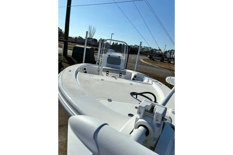 Slide: The Image of 2026 ALK2 Powerboats 17HS model, sleek design, docked outdoors under clear sky. - 2