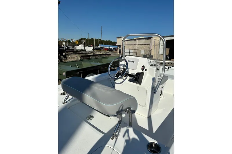 Slide: The Image of 2026 ALK2 Powerboats 17HS with sleek console and seating, docked under clear blue sky. - 5