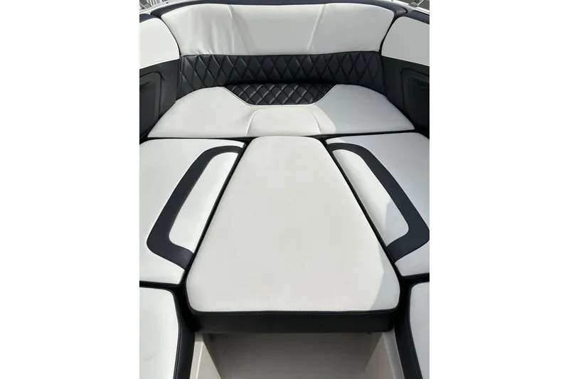 Slide: The Image of 2013 Monterey 328SS Super Sport boat interior with white and black cushioned seating. - 11