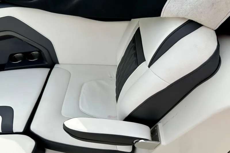 Slide: The Image of White and black seat of a 2013 Monterey 328SS Super Sport boat. - 13
