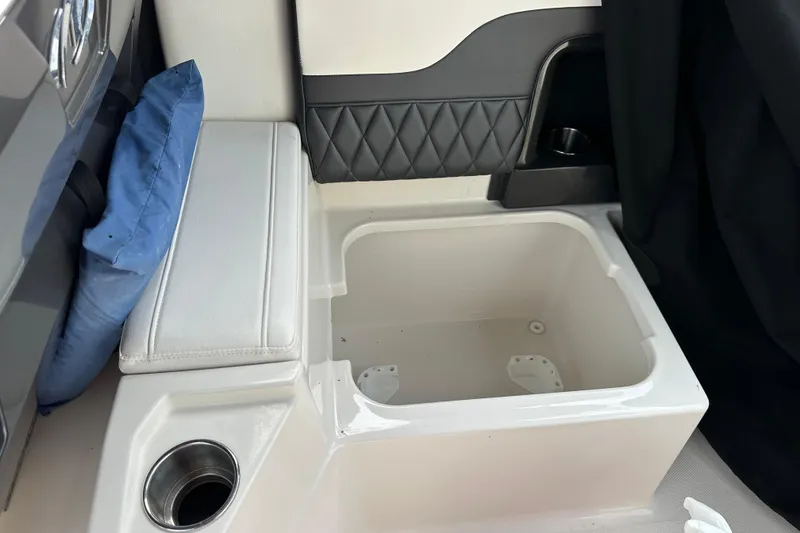 Slide: The Image of Interior of a 2013 Monterey 328SS Super Sport boat with seating and storage compartment. - 15