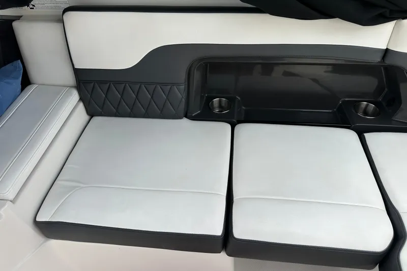 Slide: The Image of Luxurious seating on a 2013 Monterey 328SS Super Sport boat with cup holders. - 16