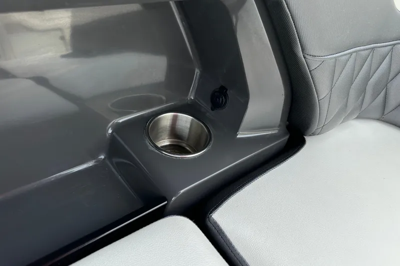 Slide: The Image of 2013 Monterey 328SS Super Sport interior with cup holder and cushioned seating. - 17