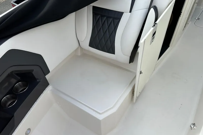 Slide: The Image of Interior of 2013 Monterey 328SS Super Sport boat with seating and storage compartment. - 6