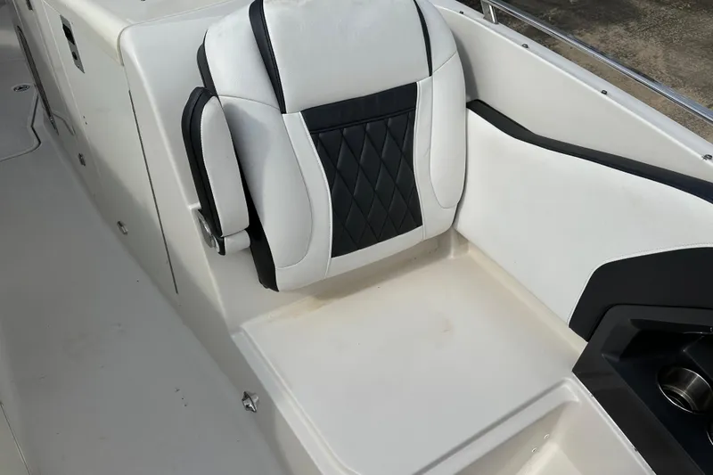 Slide: The Image of 2013 Monterey 328SS Super Sport boat seat with black and white upholstery. - 7