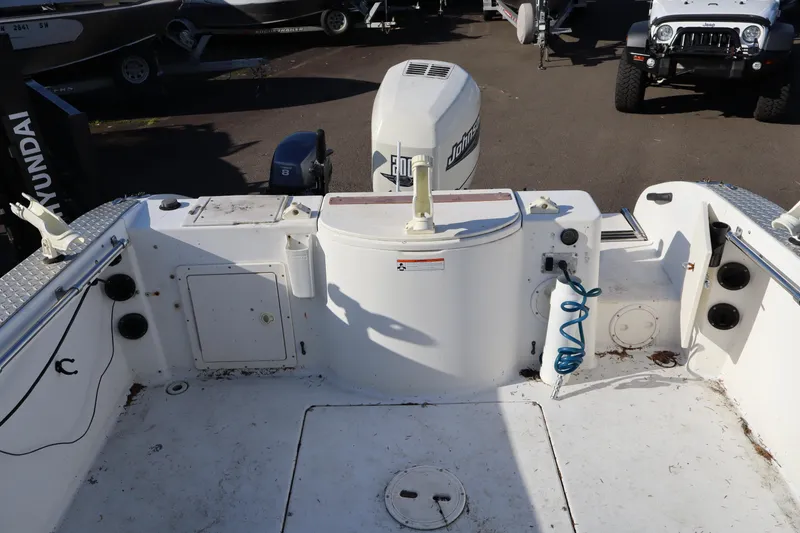 Slide: The Image of 2000 Seaswirl Striper 2300 Walkaround O/B boat deck with Johnson outboard motor. - 4