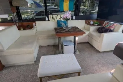 Slide: The Image of Luxurious interior of a 2013 Prestige 550 yacht with elegant seating and decor. - 13