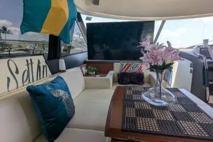 Slide: The Image of Interior of a 2013 Prestige 550 yacht featuring a compact kitchenette with appliances. - 14