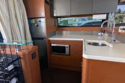 Slide: The Image of Cockpit of 2013 Prestige 550 yacht with steering wheel and navigation equipment. - 16