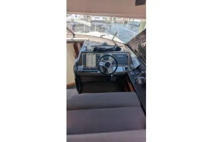 Slide: The Image of Stairway inside 2013 Prestige 550 yacht, leading to lower deck with marina view. - 17