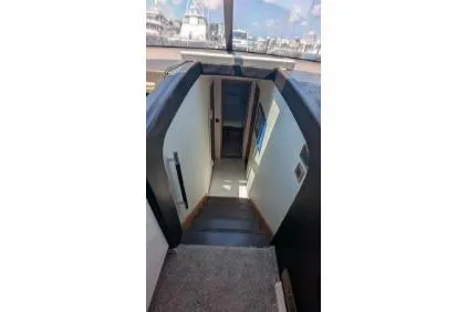 Slide: The Image of Luxurious bedroom interior of 2013 Prestige 550 yacht with elegant bedding and soft lighting. - 18