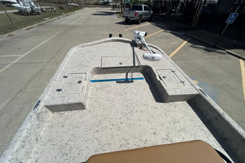 Slide: The Image of 2015 Shallow Stalker Cat 240 Pro boat deck with storage compartments and trolling motor. - 10