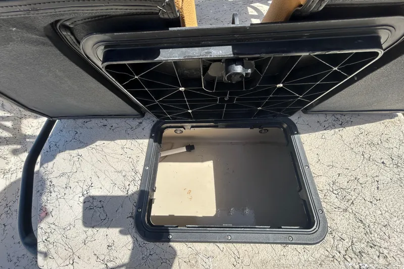 Slide: The Image of Open storage compartment on a 2015 Shallow Stalker Cat 240 Pro boat. - 16