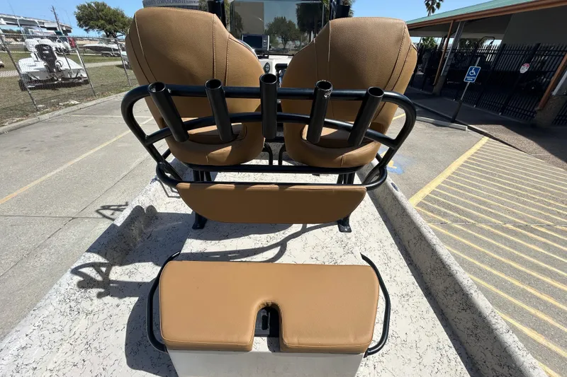 Slide: The Image of 2015 Shallow Stalker Cat 240 Pro boat with tan seating and rod holders. - 17