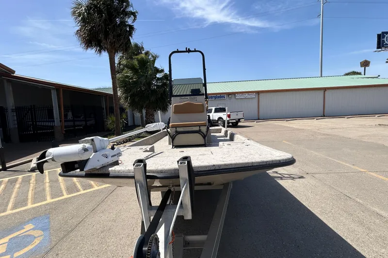 Slide: The Image of 2015 Shallow Stalker Cat 240 Pro boat on trailer in parking lot. - 2