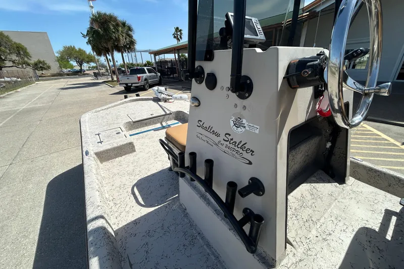 Slide: The Image of 2015 Shallow Stalker Cat 240 Pro boat, steering console view, parked outdoors. - 20