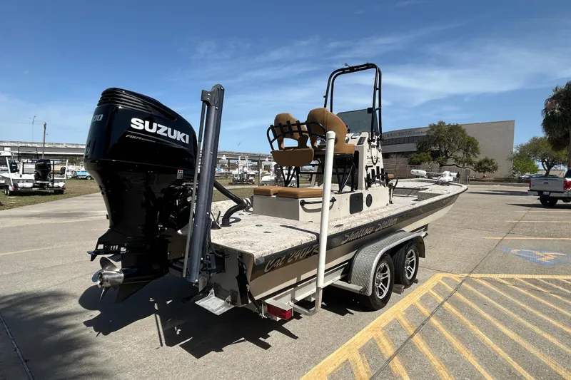 Slide: The Image of 2015 Shallow Stalker Cat 240 Pro boat with Suzuki engine on trailer. - 6