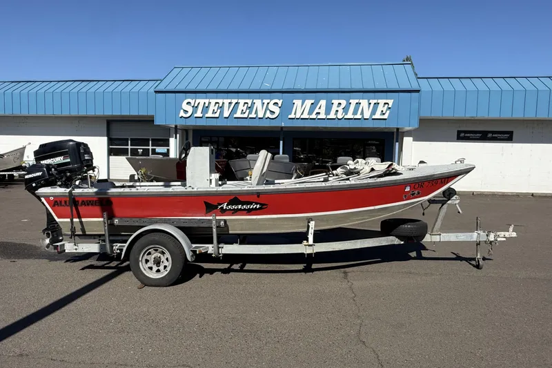 The Image of 1983 Alumaweld Center Console boat on trailer at Stevens Marine dealership. - 1
