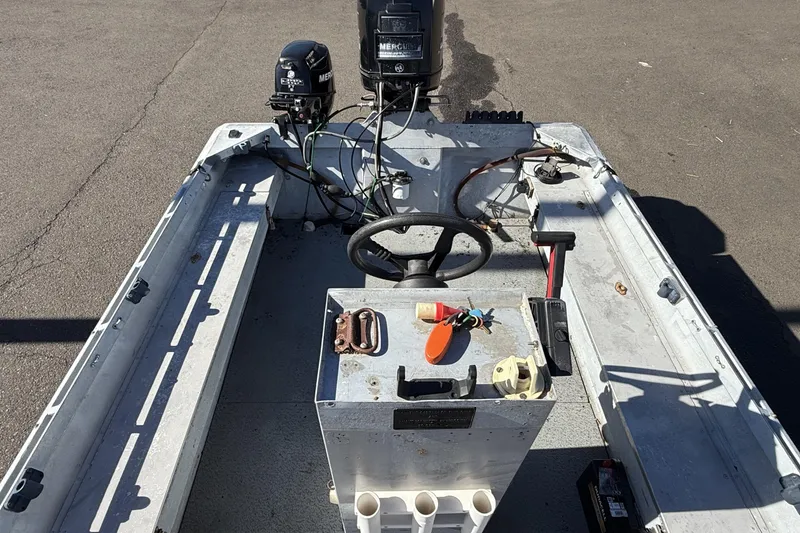 Slide: The Image of 1983 Alumaweld Center Console boat interior with steering wheel and controls. - 6