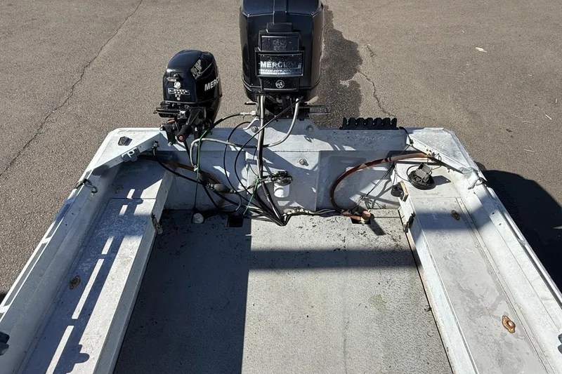 Slide: The Image of 1983 Alumaweld Center Console boat with dual Mercury outboard motors. - 9