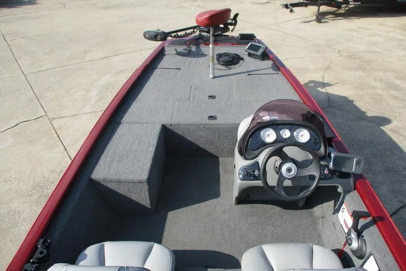Slide: The Image of 2018 Tracker Pro 170 boat interior with steering console and seating. - 2