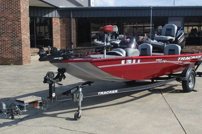 Slide: The Image of 2018 Tracker Pro 170 boat on trailer, parked outside a brick building. - 3