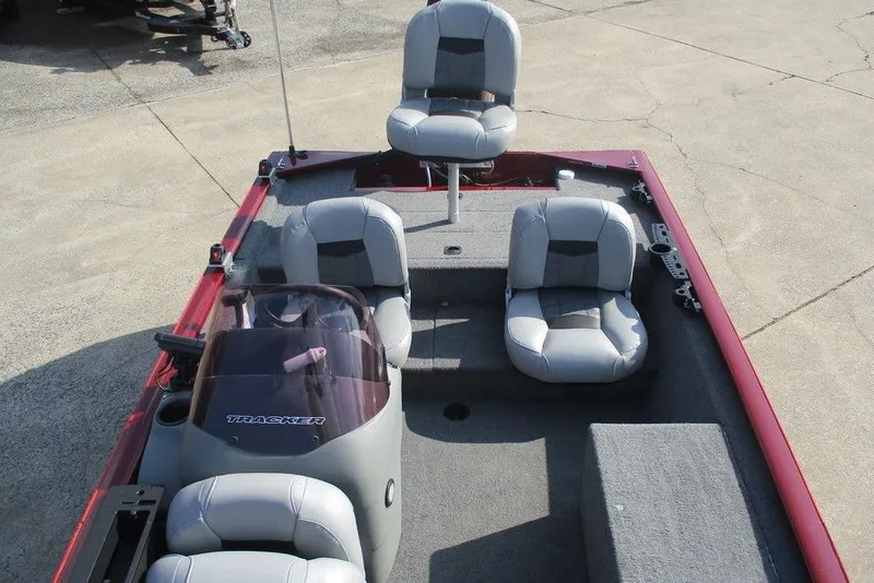 Slide: The Image of 2018 Tracker Pro 170 boat interior with four gray seats and steering console. - 5