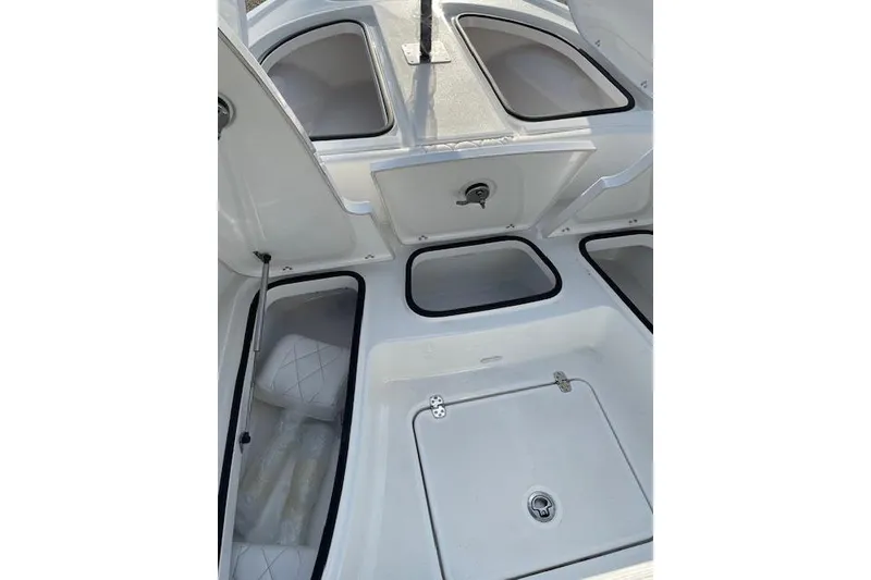 Slide: The Image of 2026 Blazer Bay 2440 boat interior with open storage compartments. - 6