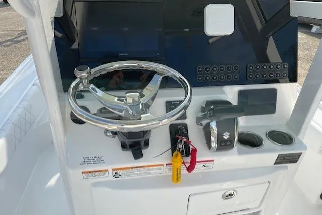 Slide: The Image of Steering console of 2026 Blazer Bay 2440 boat with modern controls and display. - 8