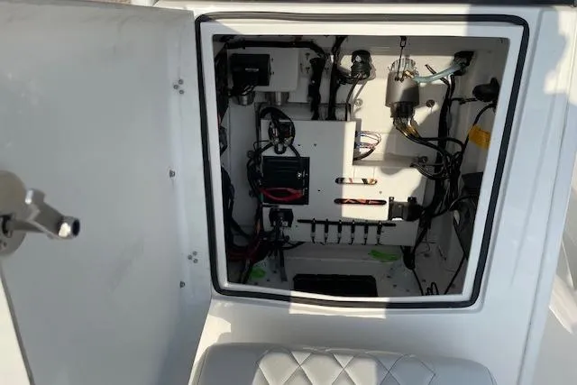 Slide: The Image of Electrical compartment of 2026 Blazer Bay 2440 boat, showcasing wiring and components. - 9