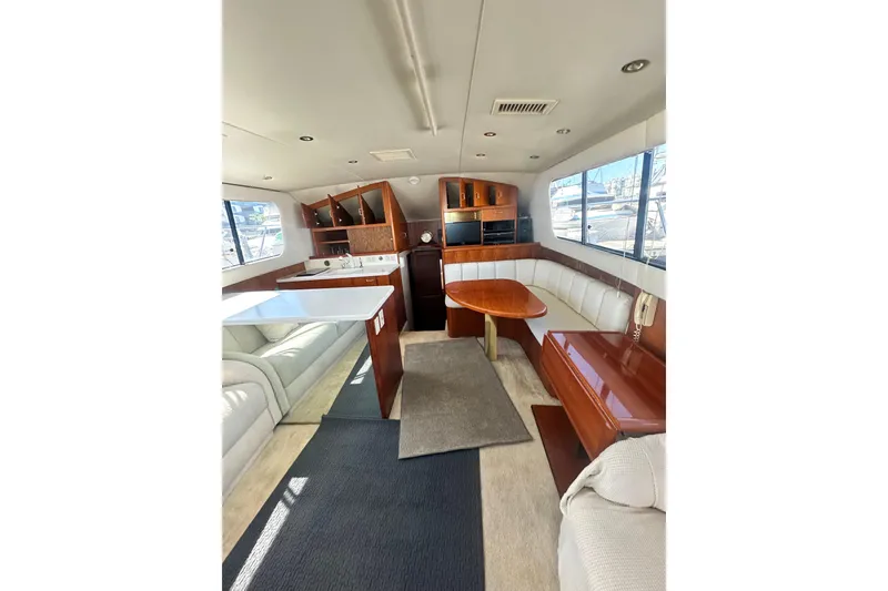 Slide: The Image of Luxurious interior of a 1994 Oceans motor yacht with elegant seating and modern amenities. - 19