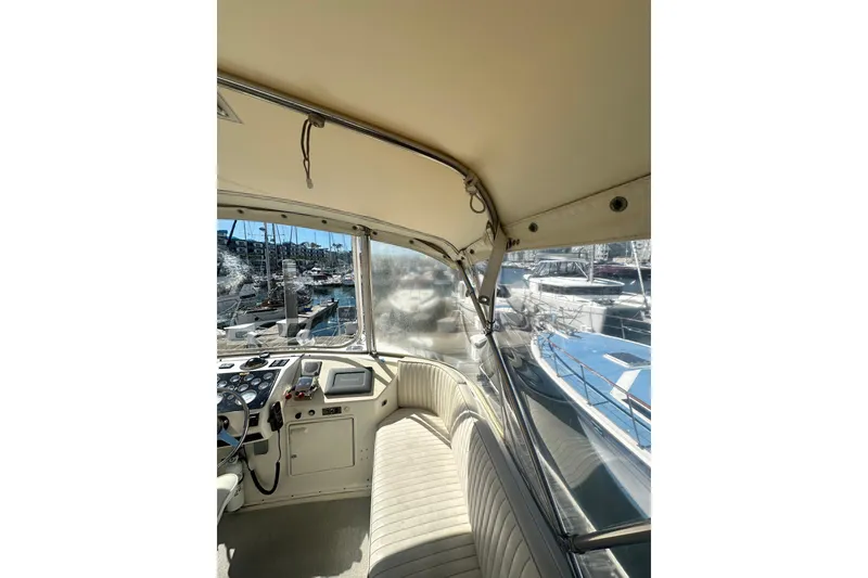 Slide: The Image of Interior view of a 1994 Oceans motor yacht, showcasing helm and seating area. - 22