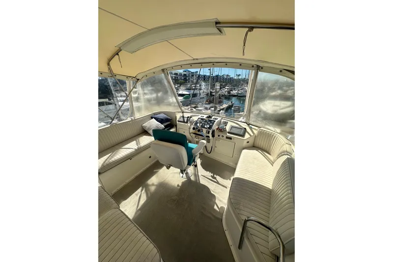 Slide: The Image of Interior view of a 1994 Oceans motor yacht cockpit with seating and controls. - 24